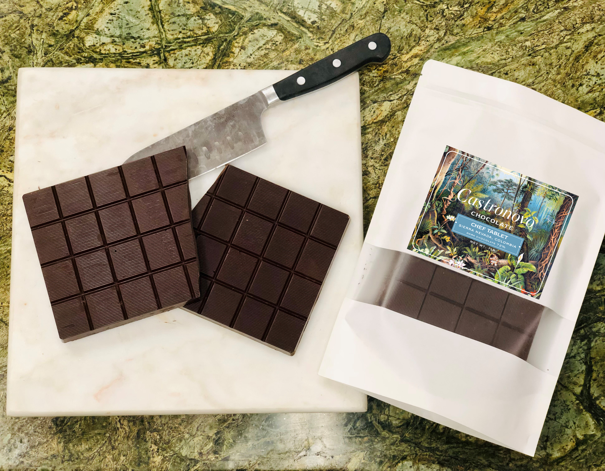 Photo of chocolate chef tablet for baking, with inside contents placed next to package on cutting board