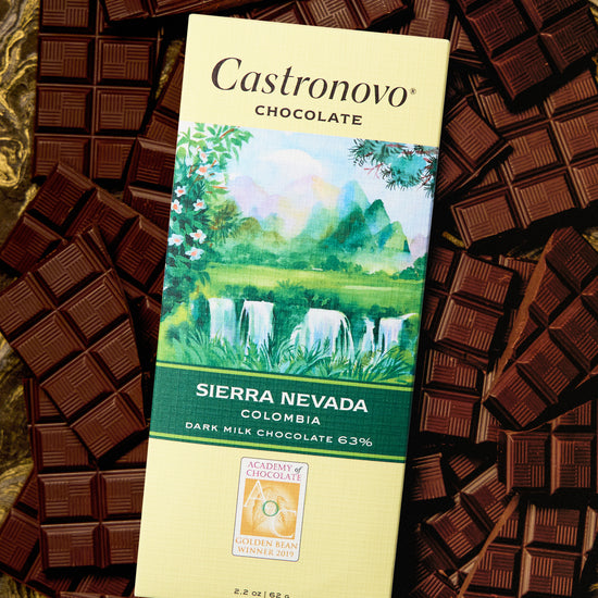 A bar of Castronovo Chocolate with Sierra Nevada Colombia 63% Dark Milk. The chocolate is displayed with multiple pieces broken away, revealing the dark texture and color.
