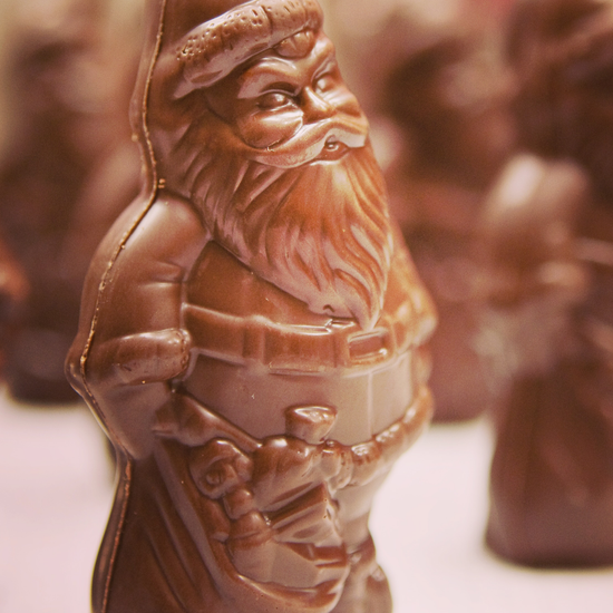 A photo of a solid chocolate Santa Claus with a blurred background 
