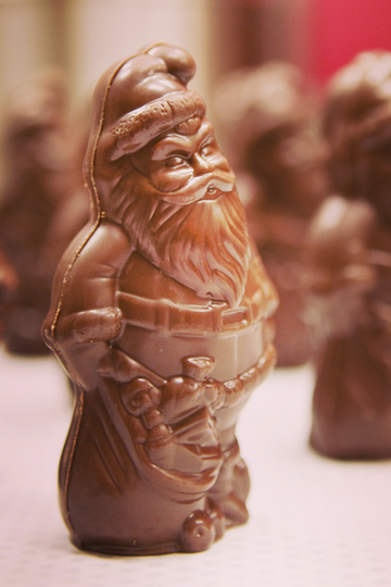 A photo of a solid chocolate Santa Claus with a blurred background 