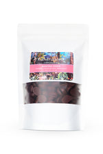 A clear plastic package of Castronovo brand dark chocolate baking chips with a colorful design and the product visible through the packaging.