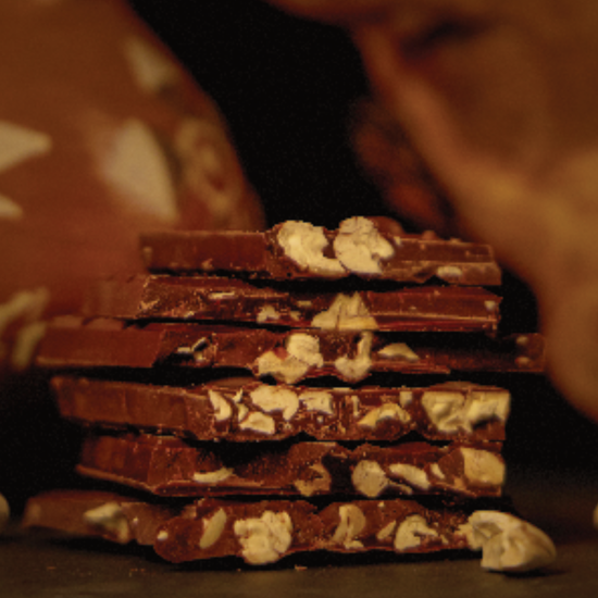 Cross-section of Castronovo brand dark chocolate with toasted Macambo pieces 