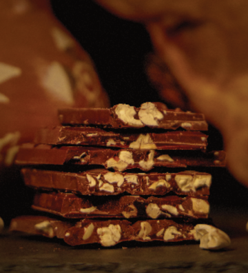 Cross-section of Castronovo brand dark chocolate with toasted Macambo pieces 